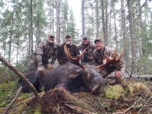 Bruce Johnson with nice Bull taken in 2018 Archery Hunt from Walleye Cove camp and Bruce Johnson with the Anderson brothers
